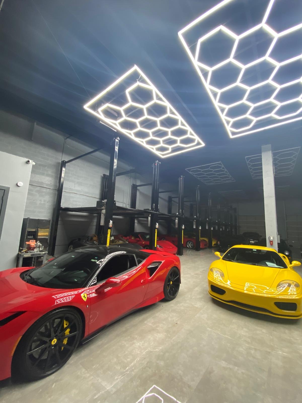 expert-staff-member-preparing-ferrari-for-storage-at-premium-luxury-car-storage-doral